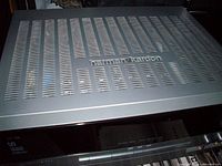 Top view of Harman Kardon AVR 355 receiver showing vented cover and logo