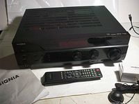 Front and top view of receiver with remote, microphone and manual