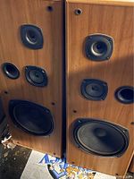 Front view of both Kenwood speakers with drivers exposed