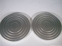 Two closed Kodak metal film cans