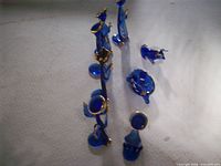 All ten cobalt blue glass nativity pieces arranged