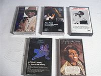 Front view of all five cassette albums showing cover art and titles