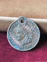 Obverse of 1883 Indian Head cent showing hole and toning