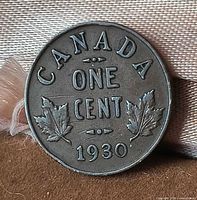 Reverse side displaying date 1930, denomination, maple leaf design