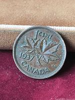 Reverse of 1937 Canadian cent showing maple leaves and date