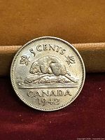 Reverse of 1942 Canadian 5-cent coin showing beaver design and year