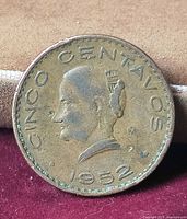 Obverse of 1952 Mexican 5 centavos coin showing bust, denomination and date