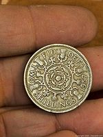 Reverse side showing Tudor rose design and denomination