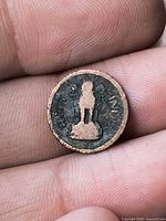 Obverse showing worn Lion Capital of Ashoka