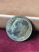 Obverse of 1966 Roosevelt dime showing date and toning