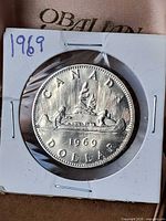 Reverse of 1969 Canada dollar in 2x2 holder