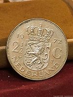 Obverse showing crowned shield, denomination, date, country name