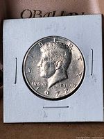 Obverse of 1972 Kennedy Half Dollar in holder