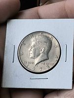 Obverse of 1973 Kennedy half dollar in 2×2 holder