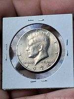 Obverse of 1974 Kennedy Half Dollar in holder