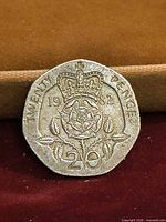 Reverse showing crowned Tudor rose, date 1982, value 20