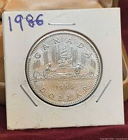 Reverse of 1986 Canada dollar in 2x2 holder