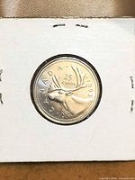 Reverse showing caribou and 1993 date inside flip