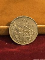 Reverse showing 25 PTAS denomination and Spanish coat of arms with eagle