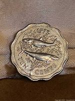 Reverse side of 1973 Bahamas 10 cent coin showing two fish and date