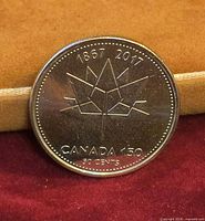 Reverse of 2017 Canada 150 50-cent coin showing maple leaf design and denomination