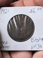 Coin in 2x2 flip showing reverse with date 1921