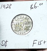 Reverse view of 1928 Canada 5 cents coin in flip