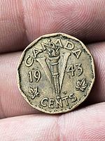 Reverse with Victory torch, date 1943, CANADA, CENTS, maple leaves, TS initials visible