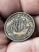 Reverse of 1945 half penny showing Golden Hind ship and date