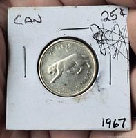 Bobcat reverse side of 1967 Canada quarter in flip