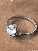 Top view of silver ring with flower-cut stone