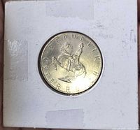 Obverse showing horse and rider, coin in flip