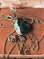 Necklace coiled showing pendant and chain