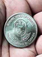 Obverse showing Olympic Trust of Canada maple leaf and rings