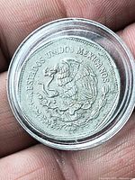 Obverse showing Mexican coat of arms within capsule