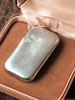 Polished pewter ingot in presentation case