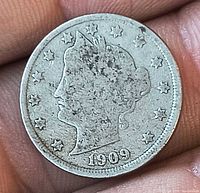 Obverse of 1909 Liberty Head nickel showing date and stars