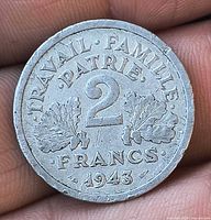 Obverse showing date 1943 and denomination within oak leaves