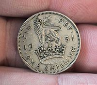 Reverse of 1951 one shilling coin showing crowned lion and legends