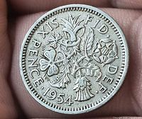 Reverse of 1954 six-pence showing floral emblems and date