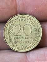 Reverse of 1972 20 centimes coin showing denomination, date, motto, laurel and wheat design