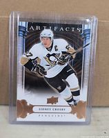 Front view of card in sleeve showing Sidney Crosby image and Artifacts branding
