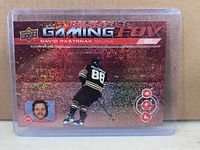 Front of David Pastrnak holographic Upper Deck Gaming FOV card in top loader
