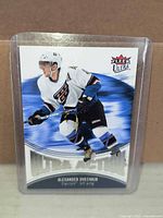 Front of Alexander Ovechkin Fleer Ultra Action UA3 card in top loader