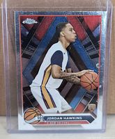 Front of Jordan Hawkins Topps Chrome rookie card in top loader
