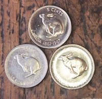 Reverse sides showing rabbit design and date 1867-1967