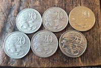 Six coins reverse side showing platypus design