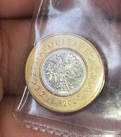Obverse of Polish 2 Zloty coin showing eagle and 2009 date in plastic sleeve