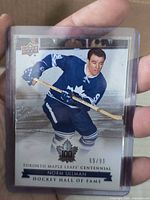 Front of Norm Ullman Toronto Maple Leafs Centennial card showing serial number 69/99