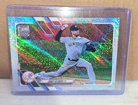 Front of Corey Kluber Topps 70th Anniversary holographic foil card in holder